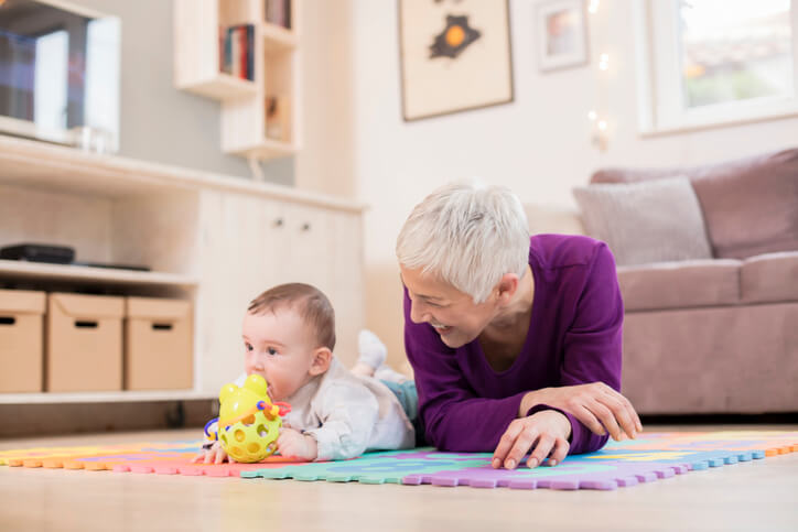 Baby tummy time with grandma