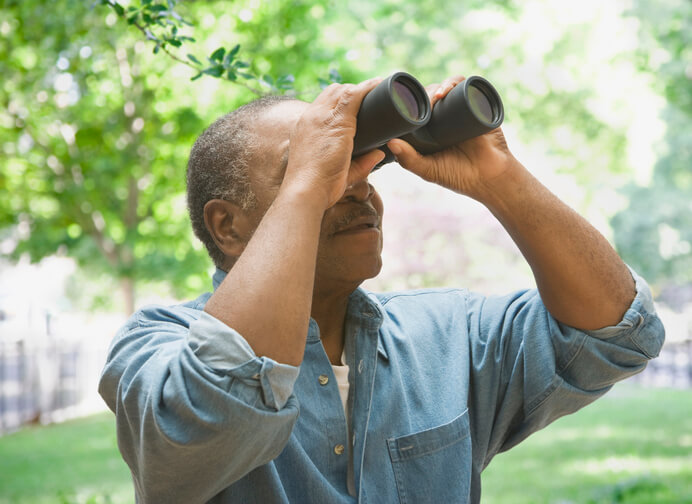 Man Bird Watching During 30 Day Wellness Challenge