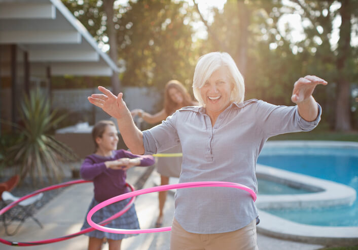 Woman Exercising With Hula Hoop For Wellness Challenge